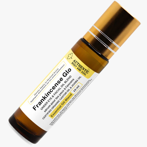 A bottle of Frankincense Glo face oil with a dropper, labeled as an essential oil blend.